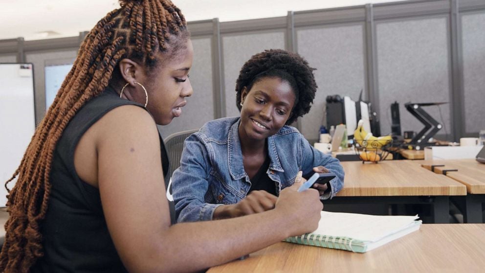 Two women working together at a table